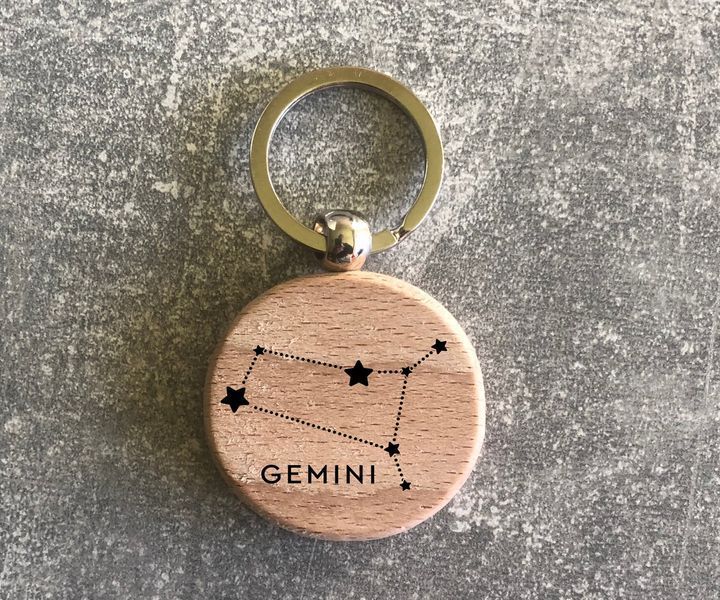 Round wooden keychain with the zodiac constellation "Gemini"