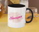 A mug with Victoria's name printed on it, white and black.