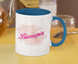 A mug with Victoria's name printed on it, white and blue.