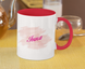A mug with a print of Inna's name, white and red