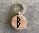 Round wooden keychain with the Elder Futhark rune "BERKANA"