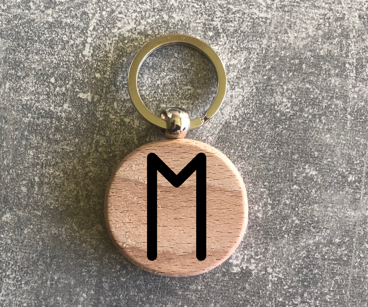 Round wooden keychain with the Elder Futhark rune "Ehwaz"